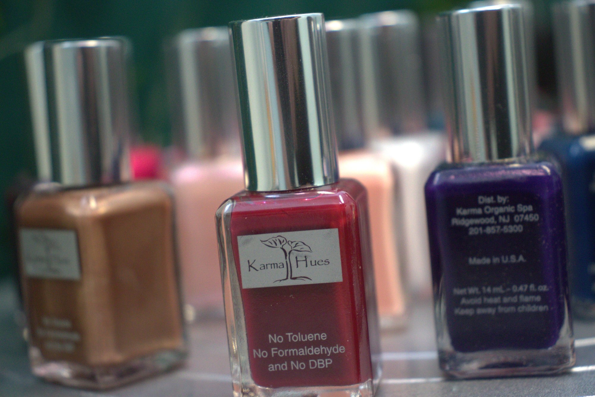 Karma Hues nail polish bottles, front view